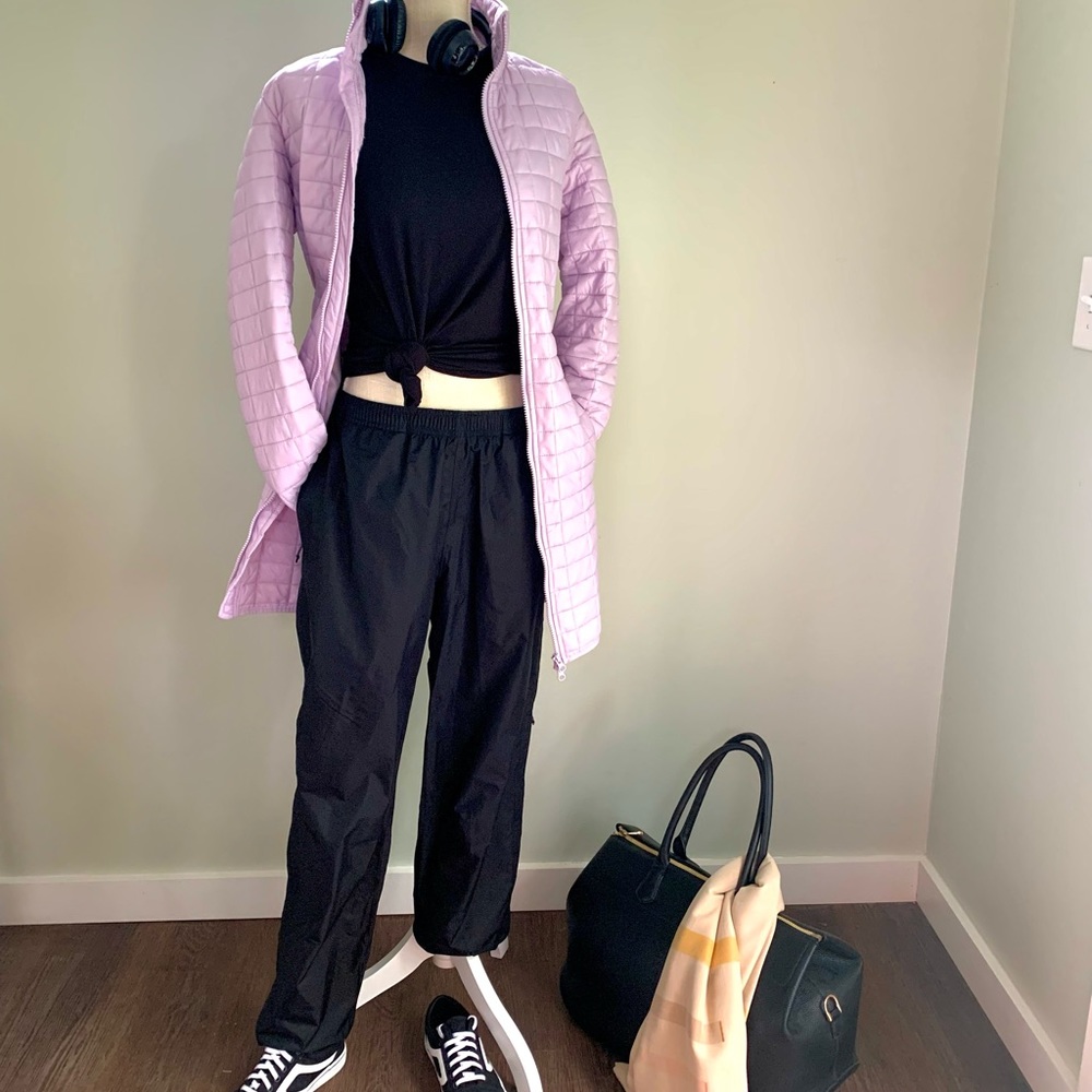 Lavender slightly fitted lightweight quilted puffer coat. Minimalist aesthetic.